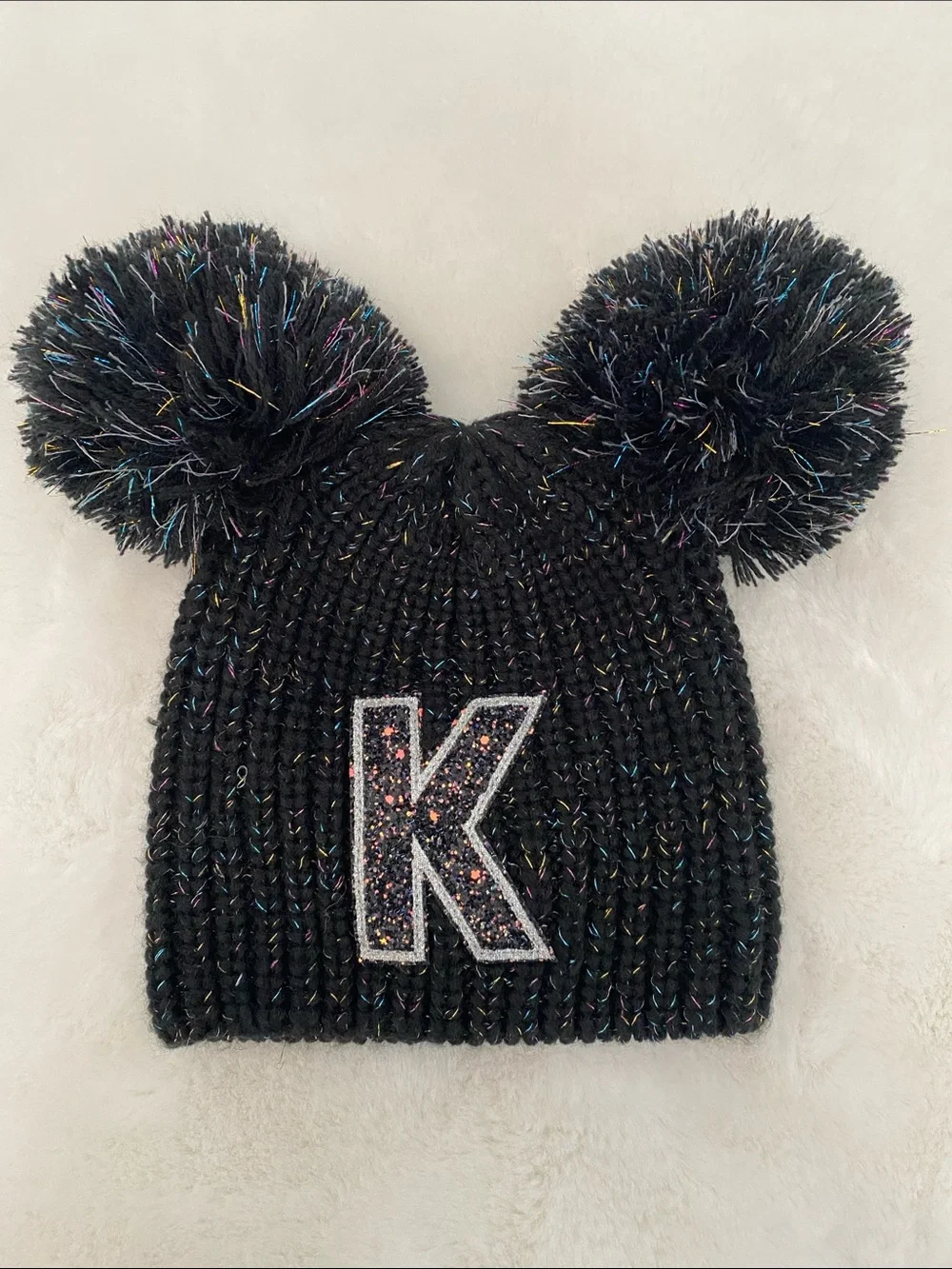 Justice Black Knit Beanie with Double Pom Poms and Glitter 'K' Patch